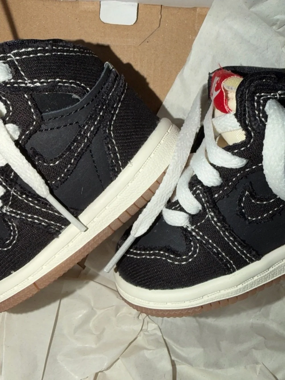 Nike Kids Black and White High-Top Sneakers with Red Accent